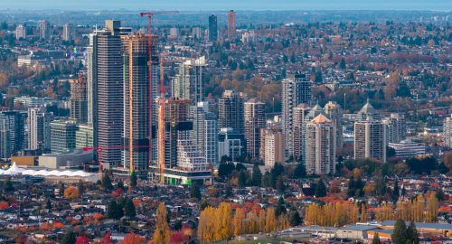 Dramatic cityscape of Burnaby and Greater Vancouver under construction, with autumn colors and high-rise developments. Burnaby, Greater Vancouver, BC, Canada.